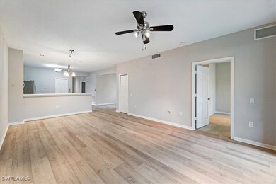 Unfurnished living room featuring a ceiling fan an