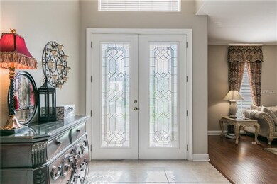 Gorgeous glass double entry doors and foyer
