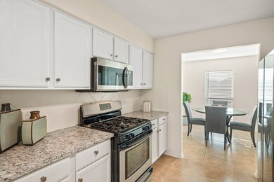 A charming breakfast room lies adjacent to the kitchen. The refrigerator is included among the stainless steel appliances!