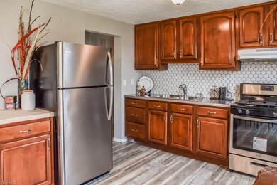 The kitchen has stainless steel appliances.