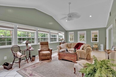 Sunroom featuring plenty of natural light, ceiling