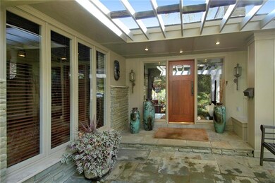 Front - Lovely pergola with Flagstone walkway.