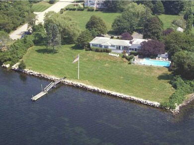 Exterior Front. Deep water dock, boat ramp, and in