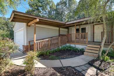 This lovely country home is nestled on a large lot, has step access entry as well as ramp. The home features a spacious, open floor plan, an attached garage and a lovely kitchen with tons of natural light.