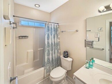 Full bathroom featuring vanity, shower / tub combo