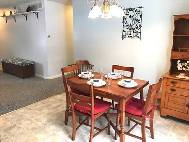 ANOTHER VIEW OF THE BREAKFAST ROOM WITH THE LIVING