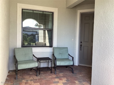 Doorway to property with a patio and stucco siding