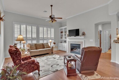 Living room featuring light wood-type flooring, bu