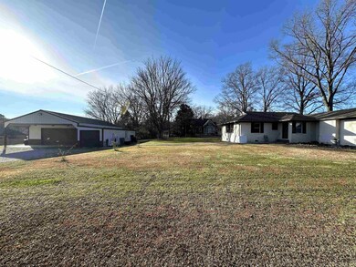 View of yard with a garage