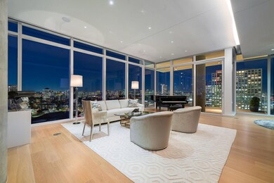 Living room with hardwood / wood-style flooring an