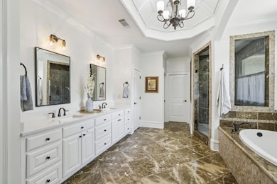 The Spa-Like Bath features Marble Tile, a Soaking Tub, and a Steam Shower worthy of a five-star retreat.