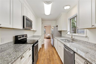 Lovely kitchen with granite counter tops and SS ap