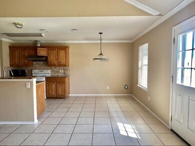 Kitchen with a wealth of natural light, white rang