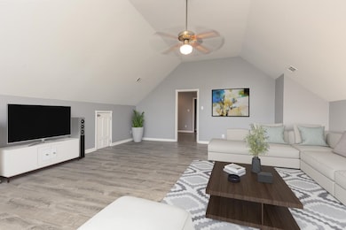Living room with light hardwood / wood-style floor