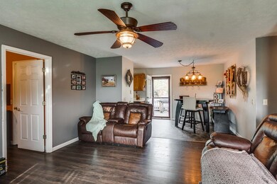 This living room is big enough for your sectionals!  New ceiling fan!!