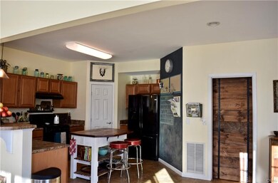 Kitchen...chalkboard wall for organization and lar
