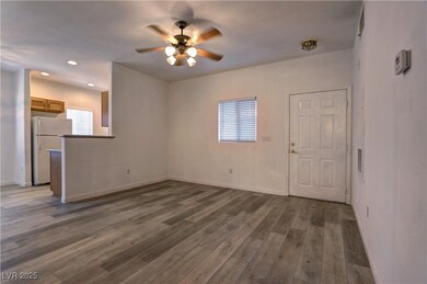 Unfurnished living room with ceiling fan, wood fin