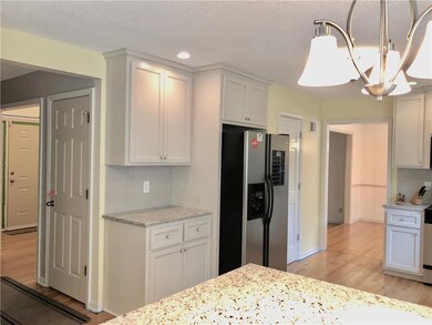 Kitchen view-Shows front door-door to LL-Formal Di