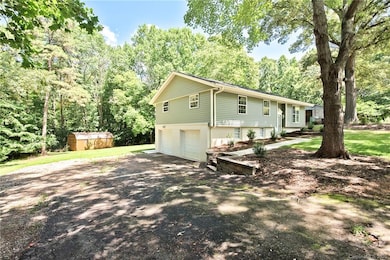 Completely renovated, 3 bedroom, 2 bath home (2 car garage) on 1.53 acres (3 parcels combined) with no HOA & blocks to Lake Norman with community boat access!