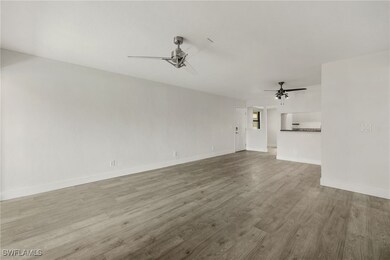 Unfurnished living room with wood finished floors,
