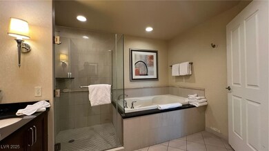 Bathroom featuring a bath, tile patterned floors,
