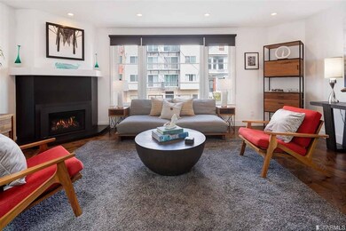 Living room with corner gas fire place.