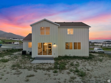 Exterior from rear including backyard.