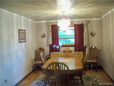 Dining Room. The formal dining room is open onto t