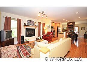 Open living with fireplace.