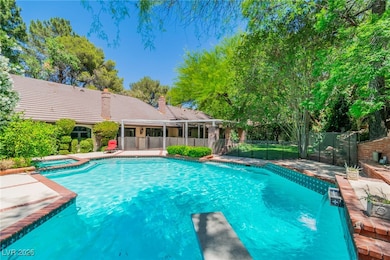 View of pool with a pool with connected hot tub