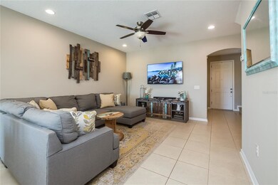 Living room with tile flooring, recessed lighting 