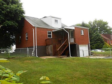 Exterior Back. A view of the partially covered por