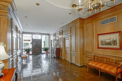 Building foyer, security guard to right