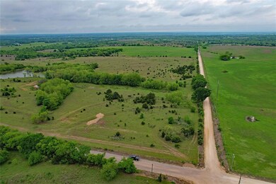 Birds eye view of property with a rural view