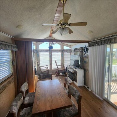Open to family room with cathedral ceiling.