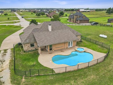 View of swimming pool with a yard, an in ground hot tub, and a patio