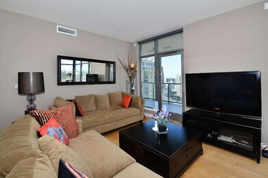 The living room opens up to the dining area and ki