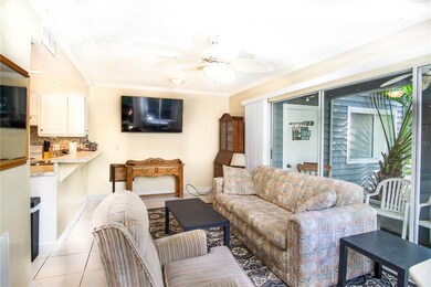 This room is completely furnished. You can see the soft light streaming though the full sliders leading out to the river.
