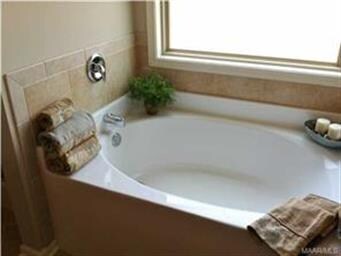Master Bath has a deep soaking tub.