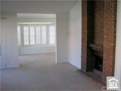 Living room looking at den