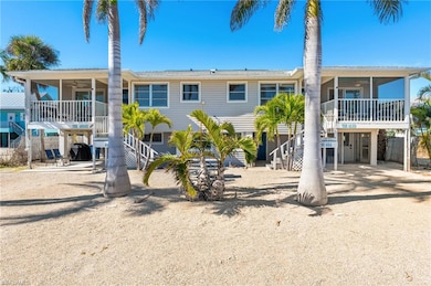 Front view of property with covered porches and ce