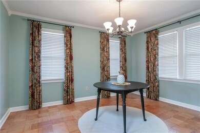 The parquet floors continue into this large formal