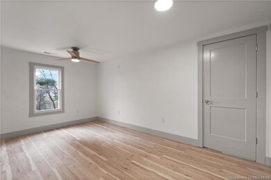 Main Bedroom w/ large walk-in closet and shiplap.