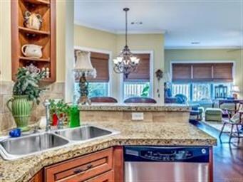 The kitchen has built-in corner shelving as well a