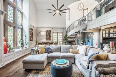 Another view of this gorgeous Great Room with lots of space, wonderful floor to ceiling windows that have an electric shade with remote.