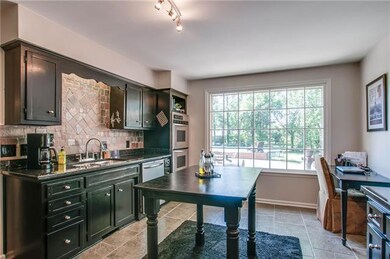 Wonderful Kitchen with Stainless Appliances and view of the park-like Backyard.  