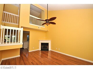 Living Room. Living room with corner fireplace and wood floors.