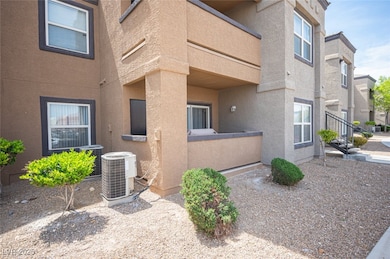 View of side of property with stucco siding, cooli
