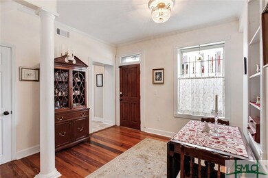 Beautiful wood floors and wide crown moulding.