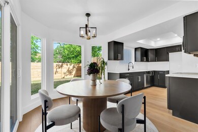 Dining room with a chandelier, light wood finishe
